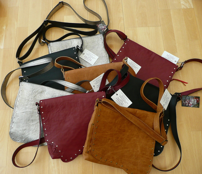 a selection of leather crossbody bags in a flat lay display